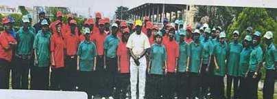 A large outdoor group photograph labelled Quality Control Crew in the company profile.