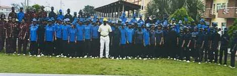 A large outdoor group photograph labelled Cleaning Crew in the company profile.